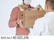 Donation box of food for people suffering from coronavirus pandemia. Стоковое фото, фотограф Сергей Толмачёв / Фотобанк Лори
