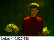 Chinese man holding respirator mask. Air pollution concept. Стоковое фото, фотограф Сергей Толмачёв / Фотобанк Лори