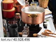 Copper pot with boiling water on a gas stove. Стоковое фото, фотограф Сергей Толмачёв / Фотобанк Лори