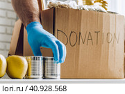 Donation box of food for people suffering from coronavirus pandemia. Стоковое фото, фотограф Сергей Толмачёв / Фотобанк Лори