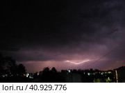 Lightning is a natural phenomenon electrostatic discharges in the atmosphere between two electrically charged regions, neutralizing in a near-instantaneous release of an average of gigajoule energy. Стоковое фото, фотограф Юлия Петровская / Фотобанк Лори
