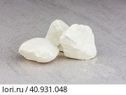 White pieces of quicklime close-up on a gray background. Стоковое фото, фотограф Андрей С / Фотобанк Лори