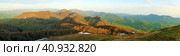 Panorama of a mountain landscape. View of yellow and green mountain ranges. Autumn mountains with remnants of last year's snow. Стоковое фото, фотограф Воловодов Владимир / Фотобанк Лори