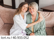 Older mature mother and grown millennial daughter laughing embracing, caring smiling young woman embracing happy senior middle aged mom. Стоковое фото, фотограф Гладских Татьяна / Фотобанк Лори