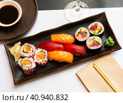 Popular Japanese dish sushi combo, which includes of Uramakis, Makis and Nigiris. Стоковое фото, фотограф Яков Филимонов / Фотобанк Лори