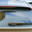 dirty rear window of the car. rear wiper. reflection of the building in the glass. close-up. Стоковое фото, фотограф Антон Вахрушев / Фотобанк Лори