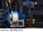 Pyrolysis boiler electric motors. Centrifugal exhaust fan to remove flue gases from the combustion chamber. Modern outdoor boiler equipment at the exhibition of the economic forum. Стоковое фото, фотограф Алексей Игнатов / Фотобанк Лори