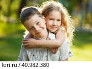 Boy and girl outdoors. Стоковое фото, фотограф Гладских Татьяна / Фотобанк Лори