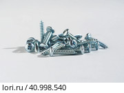 PH type chrome screws on a white background. self tapping screws. Стоковое фото, фотограф Александр Кротков / Фотобанк Лори