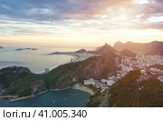 Aerial view of cityscape Rio de Janeiro city, Brazil at sunset, beachfront district. Panorama view of brazilian landscape at mountains background. Urban wallpaper concept. Copy ad text space banner (2016 год). Стоковое фото, фотограф Aleksandr Golubev / Фотобанк Лори
