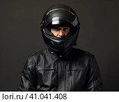 Biker in a modern helmet. Стоковое AI-изображение, AI-художник Кирилл Черезов / Фотобанк Лори