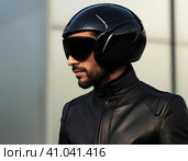 Biker in a modern helmet. Стоковое AI-изображение, AI-художник Кирилл Черезов / Фотобанк Лори