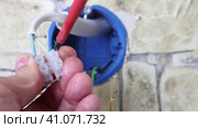 Electrical PVC screw fastening terminal block wire connector, electrician repairing socket. Стоковое видео, видеограф Владимир Григорьев / Фотобанк Лори