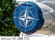 BERLIN, GERMANY - JUNE 23, 2022: NATO emblem on an aircraft engine cover. Exhibition ILA Berlin Air Show 2022. Редакционное фото, фотограф Sergey Kohl / Фотобанк Лори