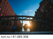 Panoramic Photograph capture sunset on massive steel construction of Poggenmoehlenbruecke bridge near the Wasserschloss Hamburg Hafencity (2018 год). Стоковое фото, фотограф Igor Tichonow / Фотобанк Лори