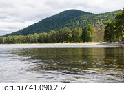 A picturesque summer landscape with a reflection of mountains and forests in the calm blue water. Chivyrkuisky Bay of Lake Baikal.Zabaikalsky National Park, Buryatia,Russia.Summer natural landscape. Стоковое фото, фотограф Регина Ерофеева / Фотобанк Лори