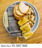 Italian bread, croutons, grissini on plate. Стоковое фото, фотограф Яков Филимонов / Фотобанк Лори