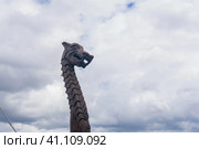 Figurehead on the bow of a full-scale replica of a viking ship, against a sky. Стоковое фото, фотограф Евгений Харитонов / Фотобанк Лори