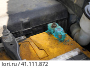 Close up battery terminals corrode dirty damaged problem, Old battery corrosion deteriorate leaking with blue acid powder. Service work by professional technicians concept. Стоковое фото, фотограф Ирина Старикова / Фотобанк Лори