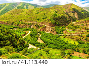 Top view of a wide gorge in the mountains of Dagestan with a network of dirt roads and an electrical substation. Стоковое фото, фотограф Владимир Ушаров / Фотобанк Лори