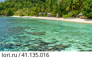 Bamboo Huts on the Beach, Coral Reef of an Homestay Gam Island, West Papuan, Raja Ampat, Indonesia (2016 год). Стоковое фото, фотограф Igor Tichonow / Фотобанк Лори