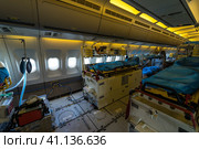 BERLIN, GERMANY - APRIL 25, 2018: Interior of the salon for evacuation and first aid to the wounded of transport Airbus A310-900 MRTT MedEvac "Hermann Kohl". German Air Force. Exhibition ILA Berlin Air Show 2018. Редакционное фото, фотограф Sergey Kohl / Фотобанк Лори
