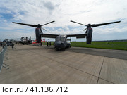 BERLIN, GERMANY - APRIL 25, 2018: V/STOL military transport aircraft Bell Boeing V-22 Osprey. US Air Force. Exhibition ILA Berlin Air Show 2018. Редакционное фото, фотограф Sergey Kohl / Фотобанк Лори
