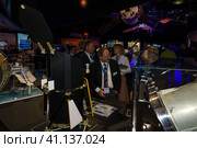 BERLIN, GERMANY - JUNE 01, 2016: The specialists on the stand of German Max Planck Institute for Extraterrestrial Physics. Exhibition ILA Berlin Air Show 2016. Редакционное фото, фотограф Sergey Kohl / Фотобанк Лори