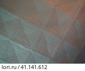 Geometric abstract background from triangles, squares and lines. Three-dimensional bulge. The volume and flex of the diagonally positioned foam material. Green, gray, orange and pink shades. Стоковое фото, фотограф Юлия Петровская / Фотобанк Лори