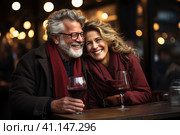 Happy and loving middle aged couple on a romantic date in a cafe in winter. Стоковое AI-изображение, AI-художник Светлана Лажко / Фотобанк Лори