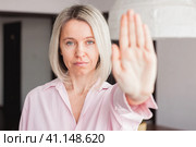 adult woman show stop gesture sign by hand saying no to domestic violence or abuse. Стоковое фото, фотограф Гладских Татьяна / Фотобанк Лори