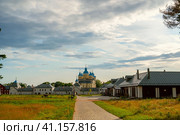 Konevsky Monastery on Konevets Island on Lake Ladoga, Russia. View of the central entrance of the monastery from the side of the forest (2023 год). Стоковое фото, фотограф Оксана Медведева / Фотобанк Лори