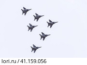 Air show in the sky above the Krasnodar airport flight school. Airshow in honor of Defender of the Fatherland. MiG-29 in the sky. Стоковое фото, фотограф Леонид Еремейчук / Фотобанк Лори
