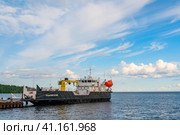 Konevets, Russia, 22 July 2023. Obstruction vessel of project 3265 Ladoga. Provides regular voyages between port points and life support for remote port points, including in ice conditions. Редакционное фото, фотограф Оксана Медведева / Фотобанк Лори