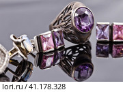 Carved silver ring with earrings with purple gemstones. Стоковое фото, фотограф Сергей Сергеев / Фотобанк Лори