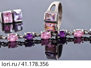 Carved silver ring with a blue gem and a silver bracelet. Стоковое фото, фотограф Сергей Сергеев / Фотобанк Лори