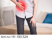 Attack of appendicitis, man with abdominal pain suffering at home. Стоковое фото, фотограф Станислав Тарко / Фотобанк Лори