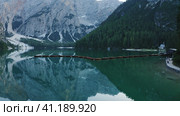 Most beautiful Lago di Braies also known Pragser Wildsee. Dolomites, Italy. Flying out over the calm. Стоковое фото, фотограф Igor Tichonow / Фотобанк Лори