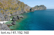 Rocky coastline formations at Hidden Beach, El Nido Palawan. Aerial drone view of karst rocks and the bay. Стоковое фото, фотограф Igor Tichonow / Фотобанк Лори