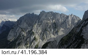 Aerial fly towards Dachstein top summit mountain top located near Hinterer Gosausee lake Upper Austr. Стоковое фото, фотограф Igor Tichonow / Фотобанк Лори