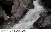 Video of popular place among tourists is waterfall on mountain river Kyngarga. Natural backgriund of beautiful mountain stream with clear blue water. Summer outdoors and travel concept. Siberia. Buryatia. Arshan resort. Стоковое видео, видеограф Виктория Катьянова / Фотобанк Лори