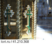 Lectern is portable piece of furniture used in celebrations of the Christian church. A close-up image of a gold cross on the side of the icon stand. Pulpits also called lecterns, rostrums and podiums. Стоковое фото, фотограф Юлия Петровская / Фотобанк Лори