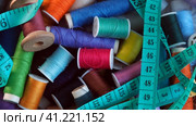 Reels with colored threads for sewing and needlework rotate. Centimeter tape. Subjects for hobby creativity and handmade. Стоковое видео, видеограф Глущенко Елена / Фотобанк Лори