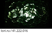 Corrugated green glass background. Abstract translucent volumetric texture pattern on the surface of a window. Liquid horror or planet Solaris. Night or space theme. Стоковое фото, фотограф Юлия Петровская / Фотобанк Лори