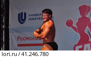 Russia, Nizhny Novgorod, Volga embankment 21, 05.06.2021. Body-building. Performance of a bodybuilder, an athlete on stage. High quality FullHD footage. Редакционное видео, видеограф Egor Sarantstv / Фотобанк Лори