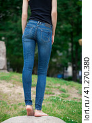 Back view of a long women legs posing with jeans. Стоковое фото, фотограф Андрей Аркуша / Фотобанк Лори