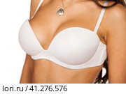 Woman breast in uplift on a white background. Стоковое фото, фотограф Андрей Аркуша / Фотобанк Лори