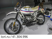 BMW R80 GS Paris-Dakar in the exhibition hall of the BMW Museum. This bike is the winner of many rally marathons of the mid-80s (2011 год). Редакционное фото, фотограф Воловодов Владимир / Фотобанк Лори
