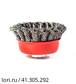 Metal cup brush for cleaning surfaces from rust and paint on a white background. The metal brush for the grinding machine is a cup made of twisted wire. Стоковое фото, фотограф Александр Кротков / Фотобанк Лори