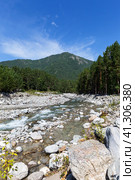 View of bed mountain river Kyngarga with green forest along banks and wooded mountains in distance on sunny summer day. Outdoor activities, hiking and traveling. Siberia. Buryatia. Arshan resort. Стоковое фото, фотограф Виктория Катьянова / Фотобанк Лори